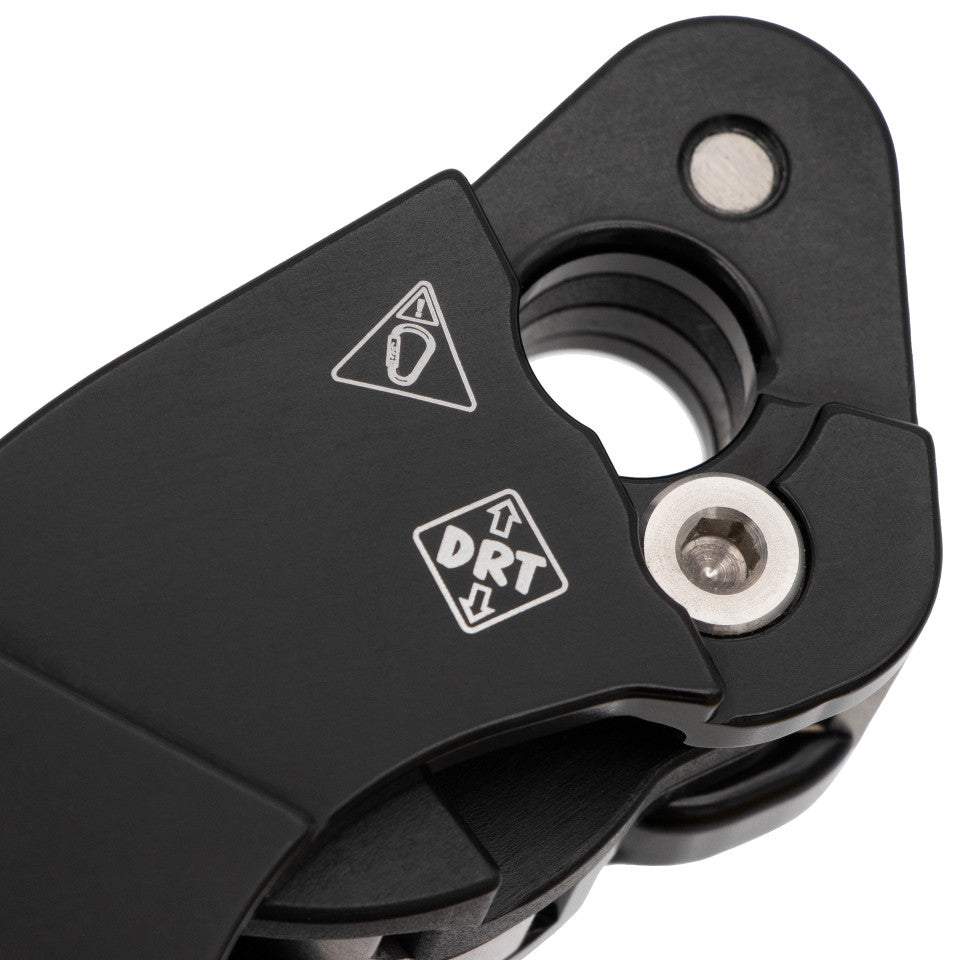 Close-up of a black metal tool with DRT branding on a white background