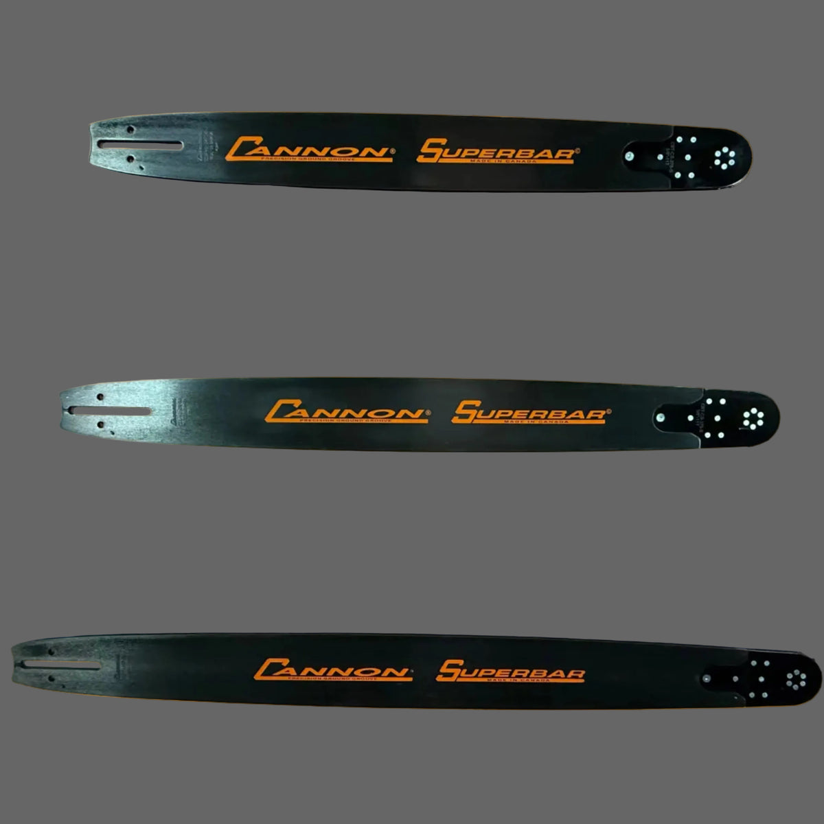 Three Cannon Superbar chainsaw bars on an gray background