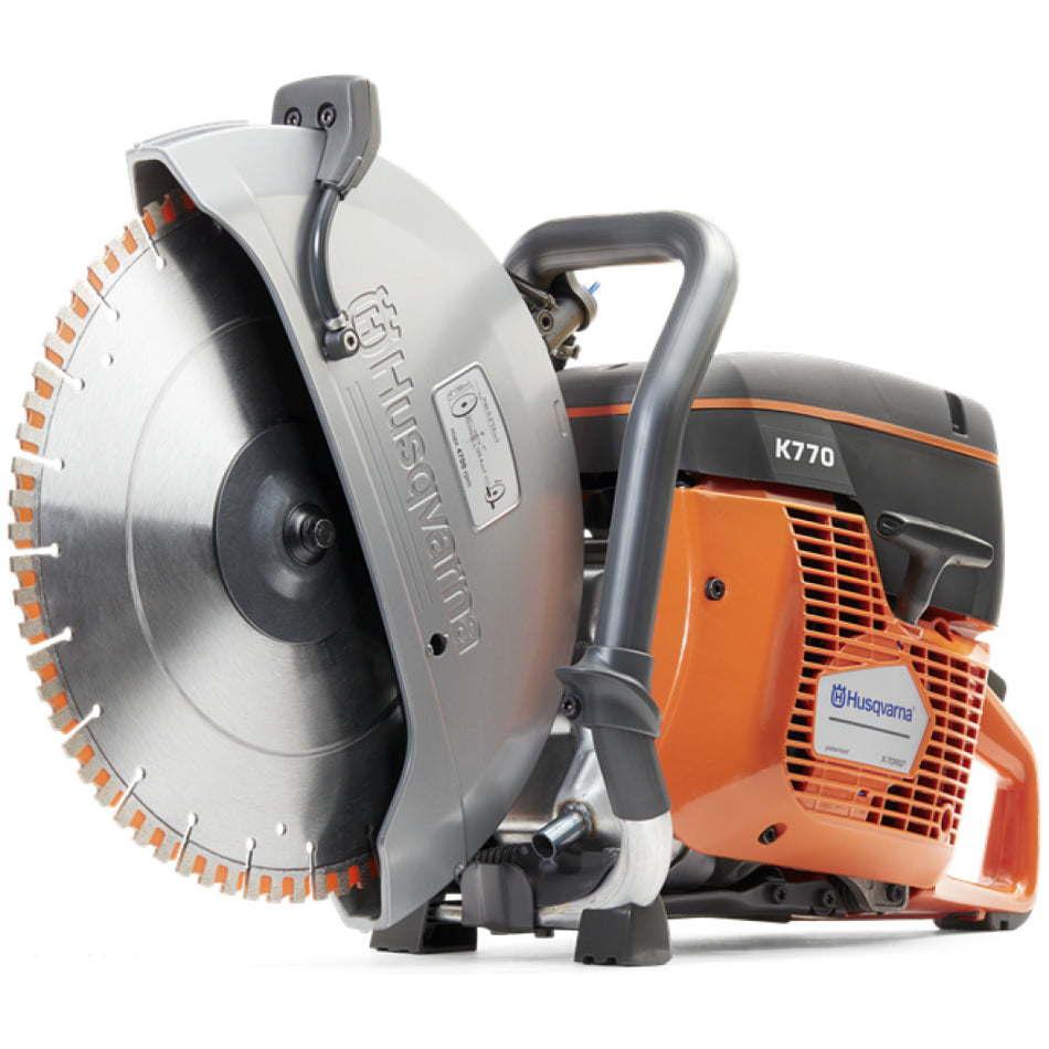 Husqvarna K770 Power Cutter with a large silver diamond blade, protective silver guard, and orange and black engine housing on a white background.