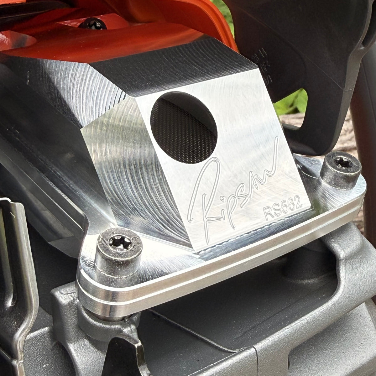 A Husqvarna 562 with a Ripsaw Signature Series Chainsaw Exhaust