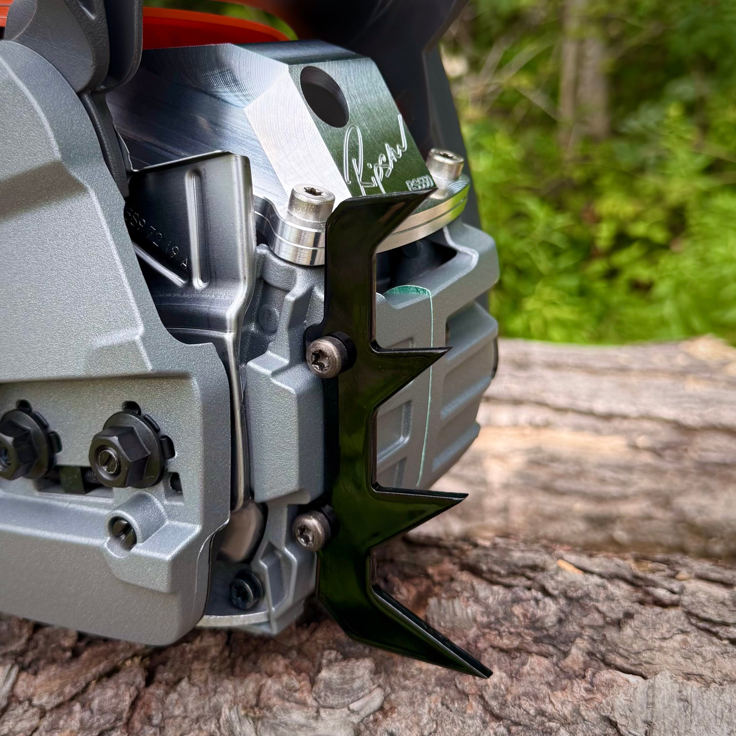A Ripsaw 4 point felling dog installed on a Husqvarna 550xpg