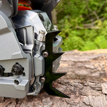 A Ripsaw 4 point felling dog installed on a Husqvarna 550xpg